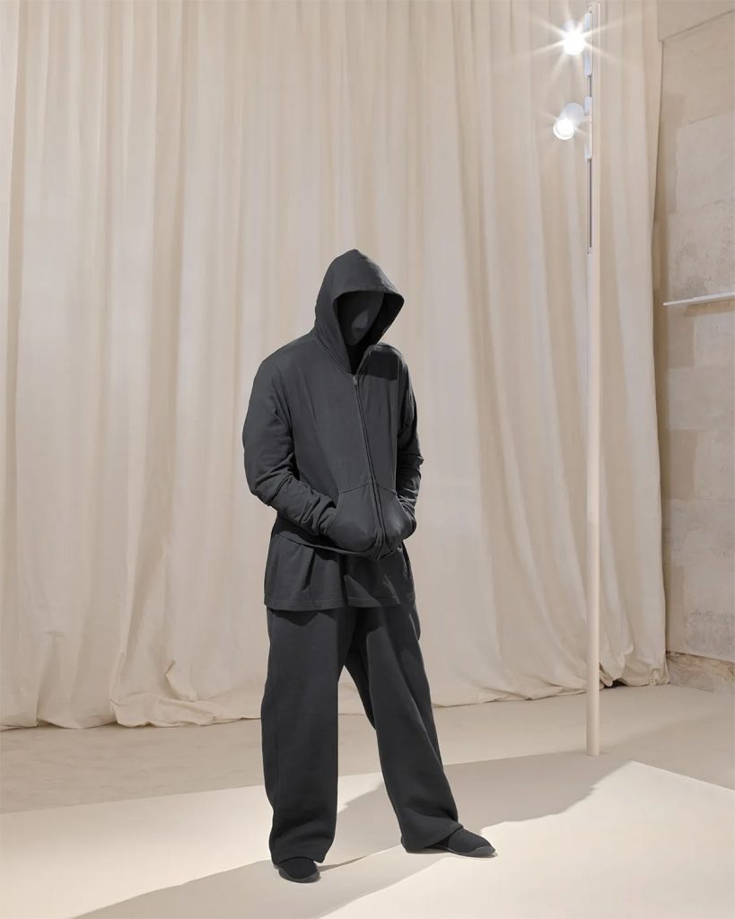 A Demna sculpture by Mark Jenkins, in which the designer wears a zip-up hoodie, baggy sweatpants, t-shirt, and Space shoes from his summer 2022 Red Carpet show for Balenciaga | Source: Balenciaga