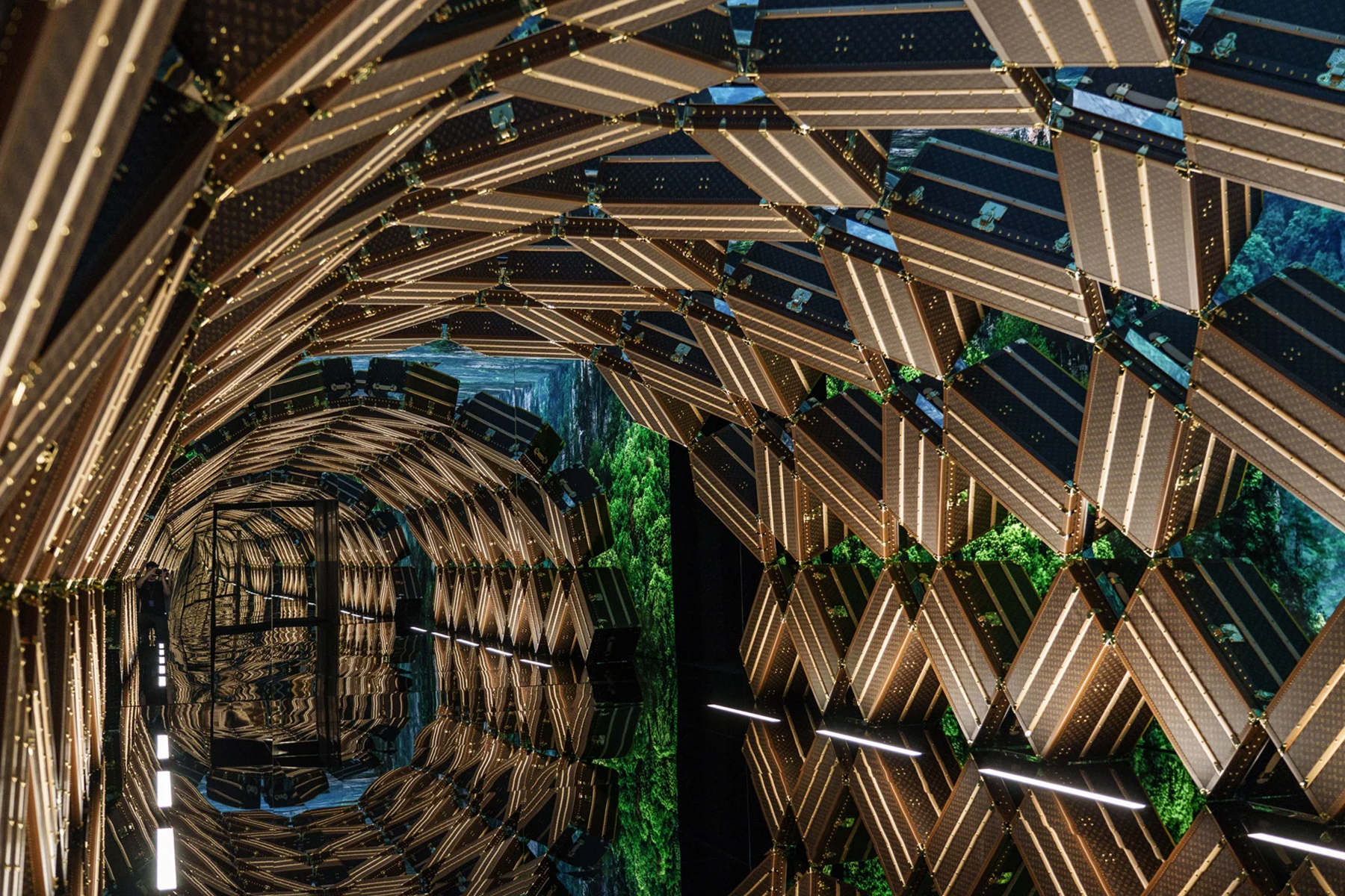 The entrance is a visually immersive archway featuring Louis Vuitton's monogram canvas trunks | Source: Louis Vuitton